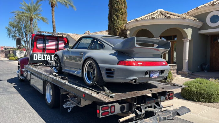 delta towing grey porsche